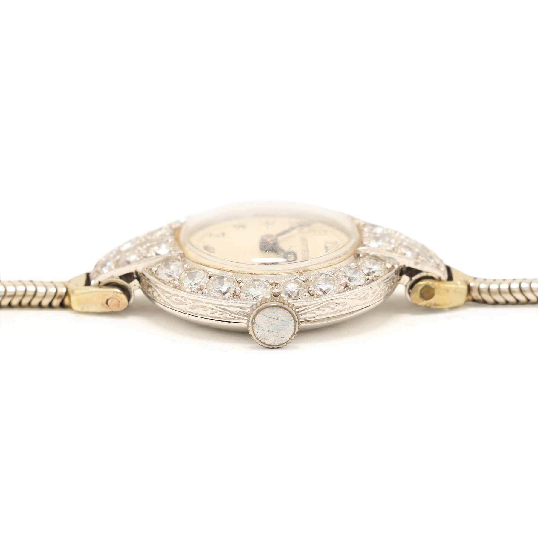 Vertex Supreme ladies platinum and 9ct white gold diamond manual wind wristwatch, silvered / white dial with Arabic hour markers, the bezel set with thirty-two round brilliant cut diamonds, stamped Platinum, on a white gold snake bracelet, Birmingham 1967, total diamond weight approx 1.60 carat