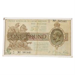 Two King George V Bradbury one pound notes, C46 154099 and P147 502441, in small glass frames