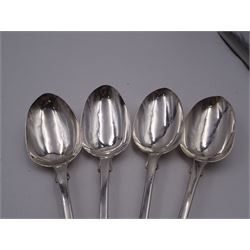 Group of Victorian silver fiddle pattern spoons, comprising pair of sauce ladles and set of six teaspoons, both hallmarked Henry Holland (of Holland, Aldwinckle & Slater), London 1857, set of four table spoons, hallmarked Chawner & Co (George William Adams), London 1857, and set of six dessert spoons, hallmarked Chawner & Co (George William Adams), London 1856, with monogrammed terminals, approximate total silver weight 25.50 ozt (792.6 grams)