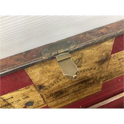 Leather shotgun case, the red baize lined interior with the trade labels of Westley Richards & Co., London, a brass plaque inscribed 'T Nevin, Mirfield, Yorkshire' to cover, with key, case to fit barrel 76cm (30 inches)  
