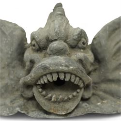 19th century cast lead fountain head with spout in the form of a grotesque fish, the mouth agape with rows of teeth, flanked by protruding fins 