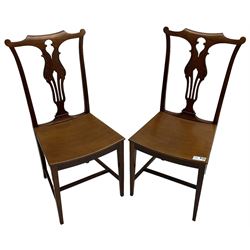 Early 20th century pair of mahogany side chairs, shaped cresting rail over shaped and pierced splat carved with curled leaf decoration, dished seat on square tapering supports united by H-stretchers 