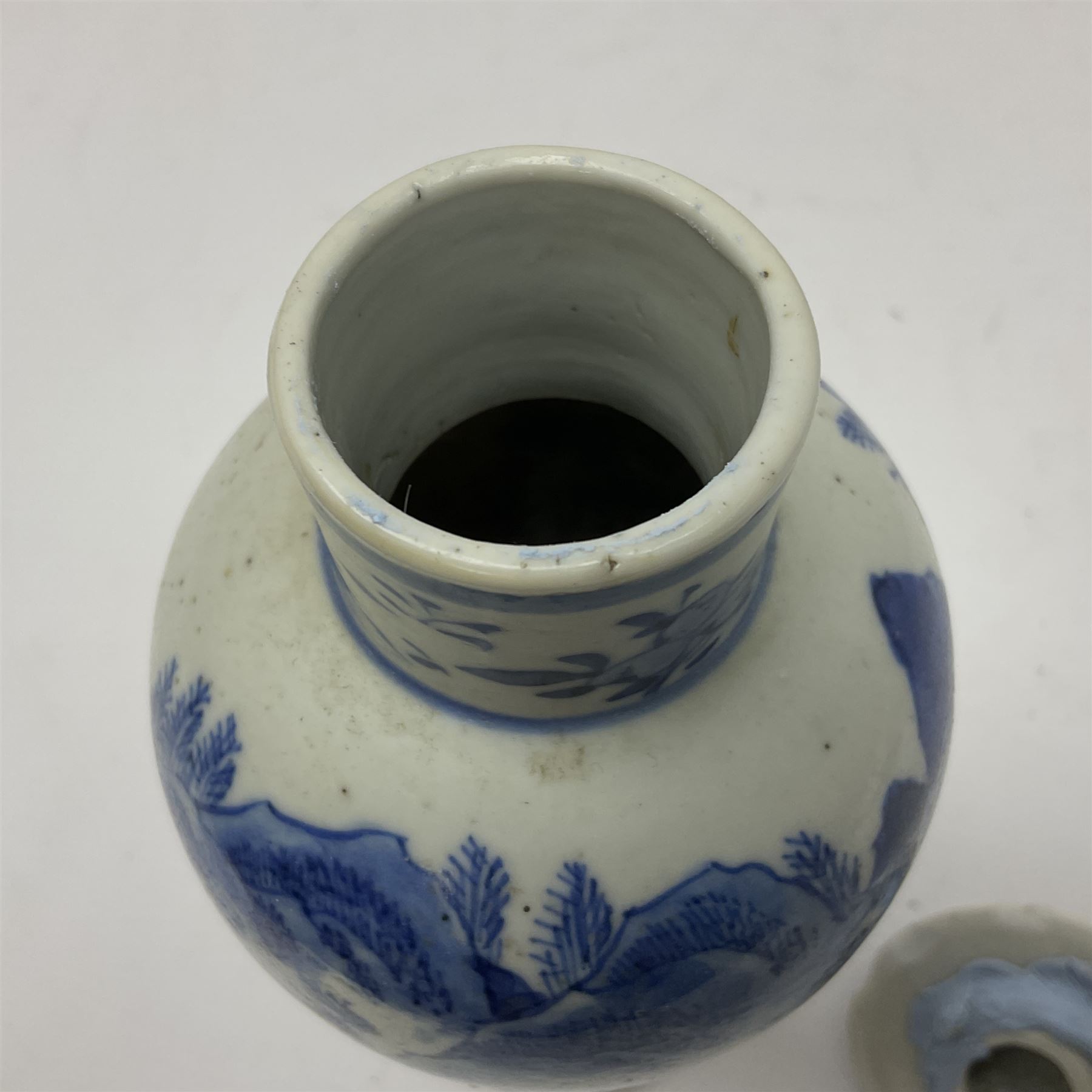 19th century Chinese Kangxi style blue and white jar and cover, decorated with figural and landscape scenes, the domed cover with foo dog finial, with four character marks beneath, H22cm