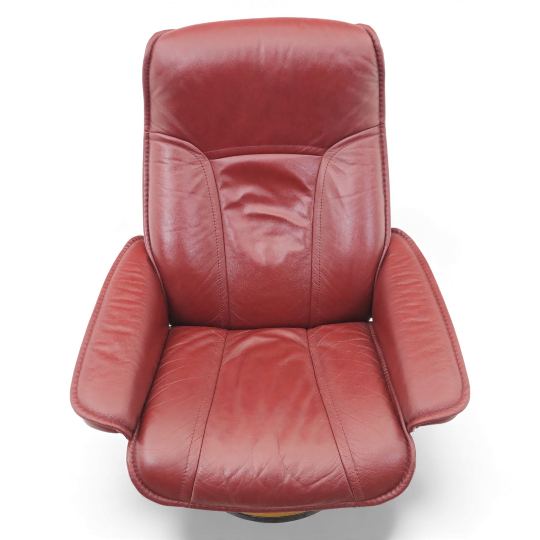 Ekornes - 'Stressless' maroon leather reclining swivel armchair, with high padded back and panel-stitched upholstery, shaped armrests, on a circular laminated wood swivel base