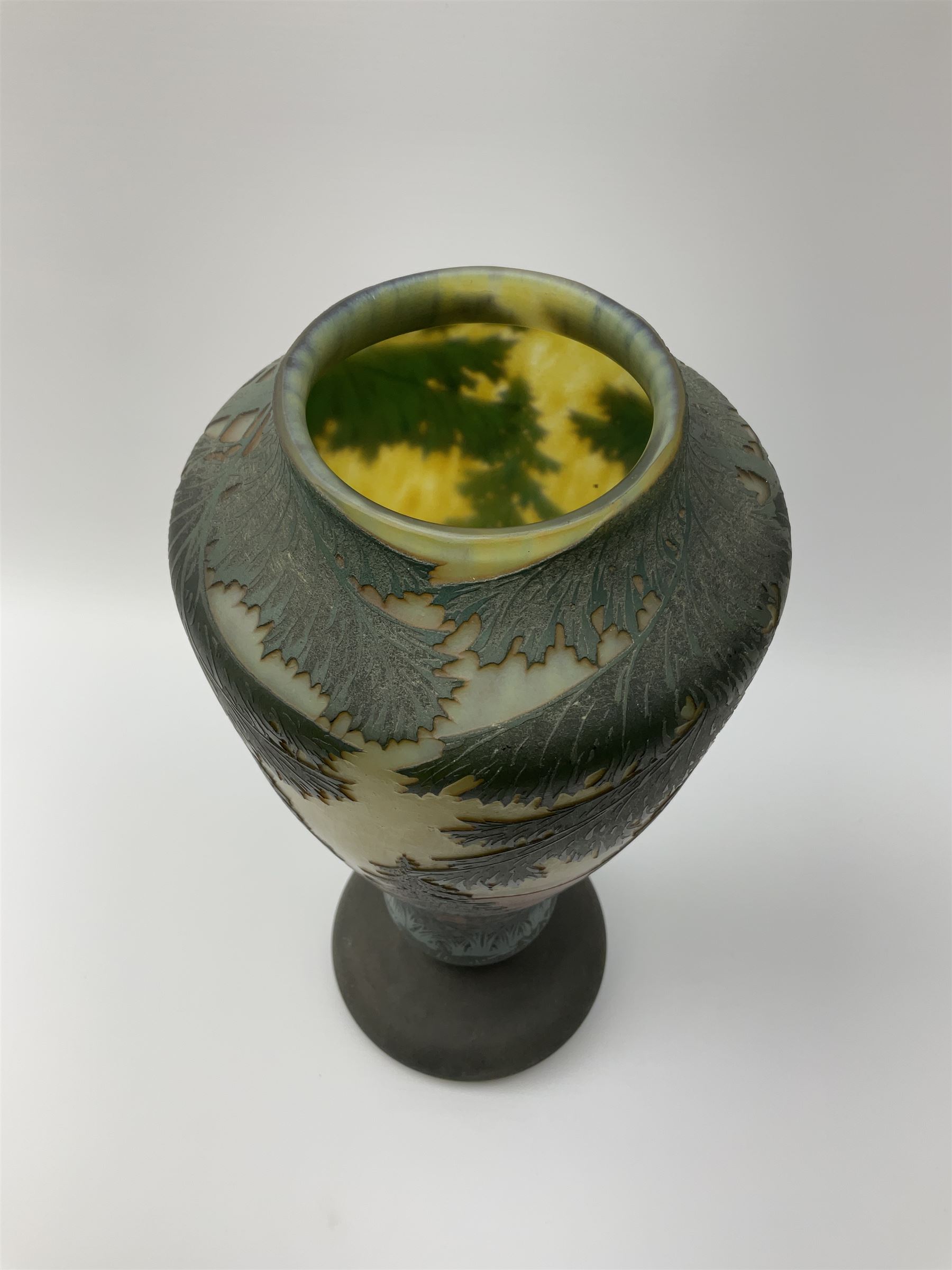 Reproduction Daum Nancy art nouveau  style overlay and cut glass vase in ovoid form with a circular base, decorated with woodland and mountain scene, H38.5cm. 