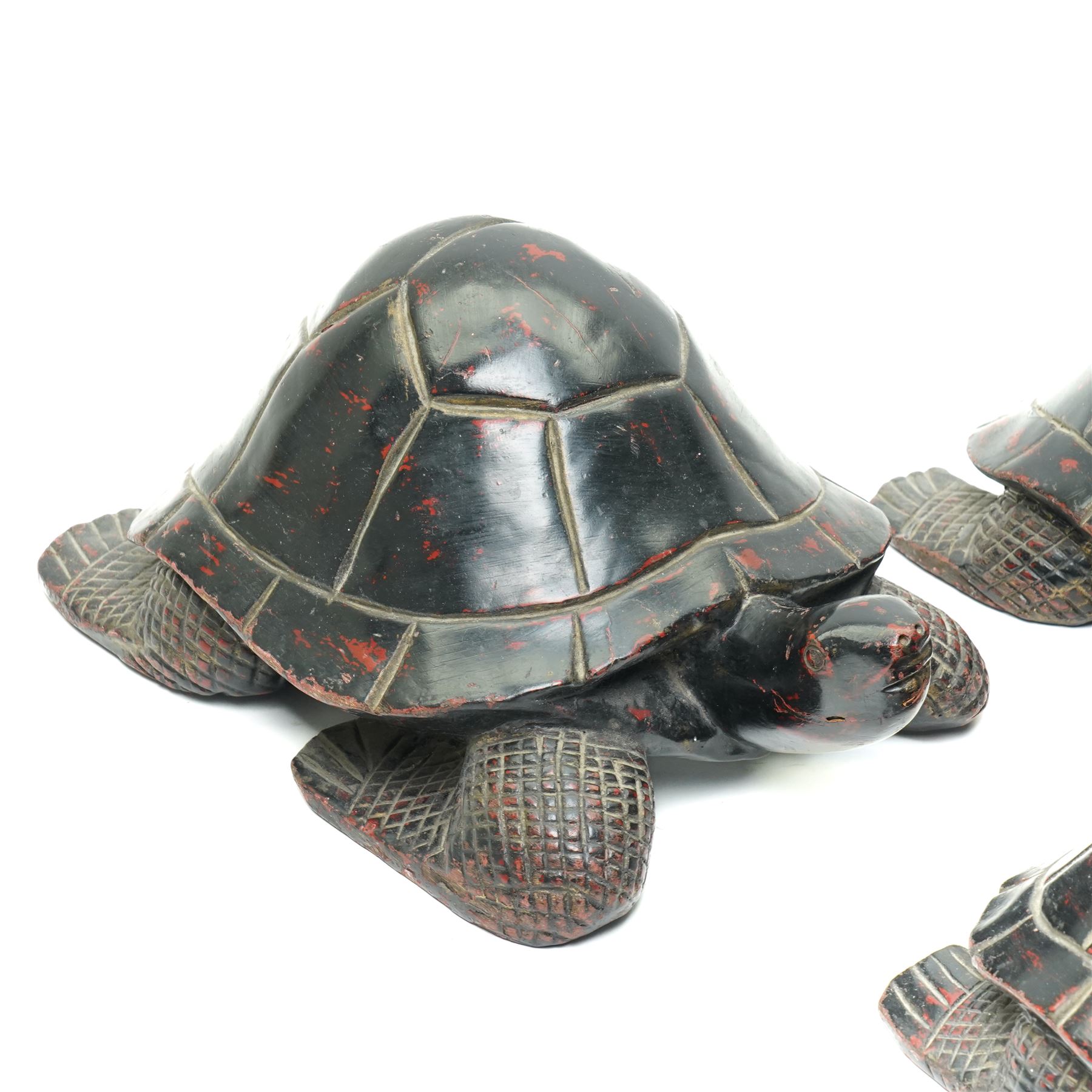 Set of four Asian carved and lacquered graduated ornamental turtles, largest L30cm