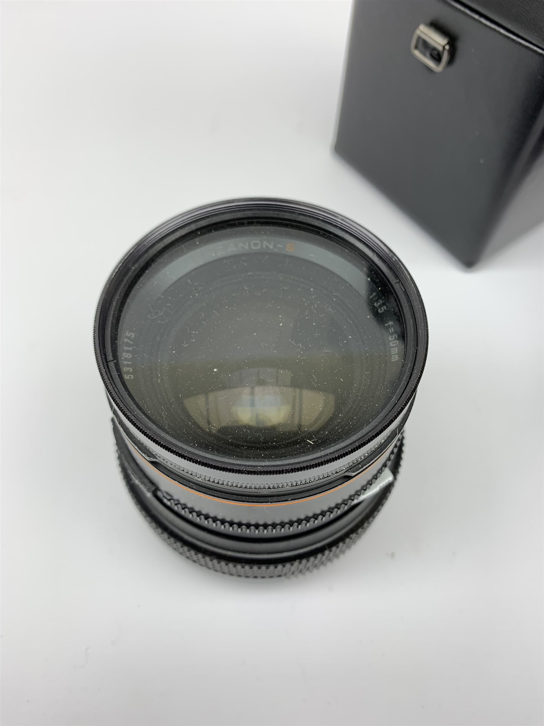 'Zenza Bronica SQ-B' camera fitted with 'Zenza Bronica Zenzanon-PS 1:28 f=80mm' lens, 'Zenza Bronica Zenzanon-PS 1:4 f=150mm' lens and 'Zenza Bronica Zenzanon-S 1:35 f=50mm' lens, with an instruction booklet