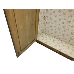 Early 20th century Italian walnut armoire wardrobe, the pierced and scrolling pediment carved with acanthus leaf detail, flanked by two scrolling cartouche with matching corbels below, the two panelled doors with applied carved rinceaux slips, with a central spiral turned upright, enclosing single shelf and hanging rail, raised on scroll feet