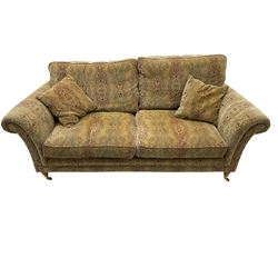Parker Knoll two seat sofa, upholstered in natural beige patterned fabric
