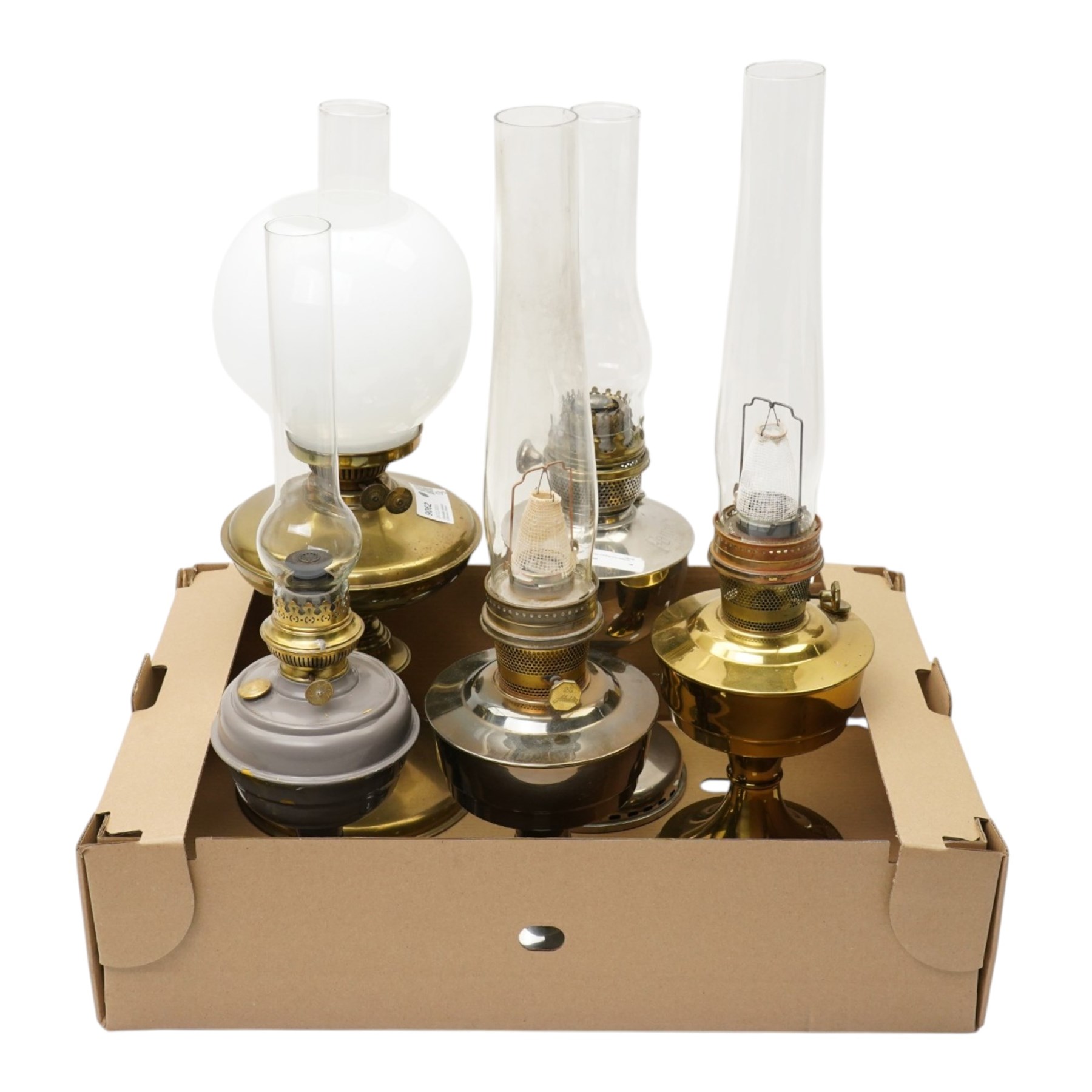 Brass table oil lamp of circular form, two Aladdin 23 lamps, Famos lamp and one other