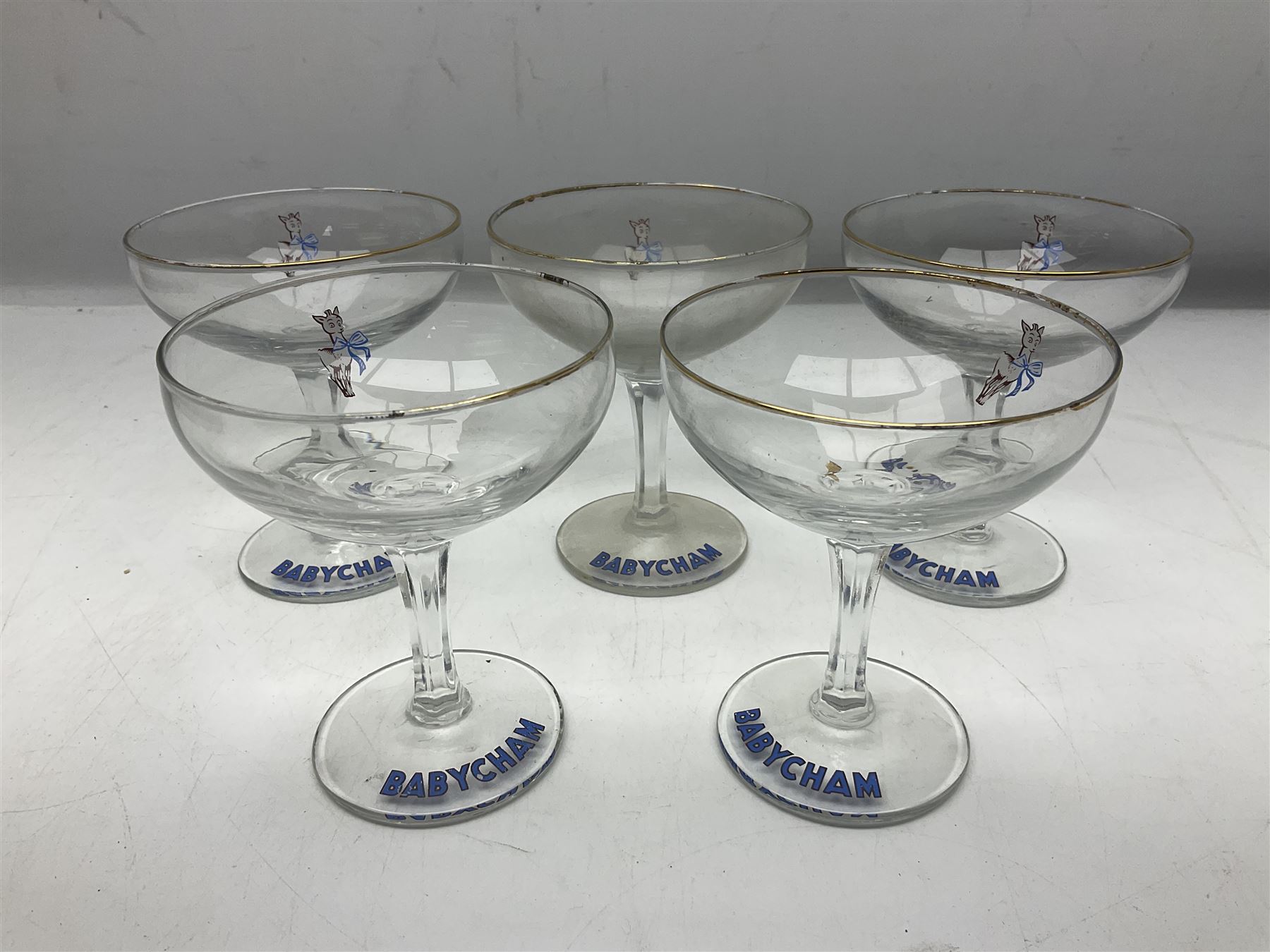 Five Babycham glasses, together with five paperweights, to include examples from Liskeard glass etc