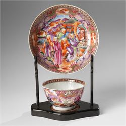 Two pairs of 18th/19th century Chinese export tea bowls and saucers, the first decorated in the 'Mandarin Palette' in typical colourways, the other famille rose examples painted with figures near a window, all unmarked (4)