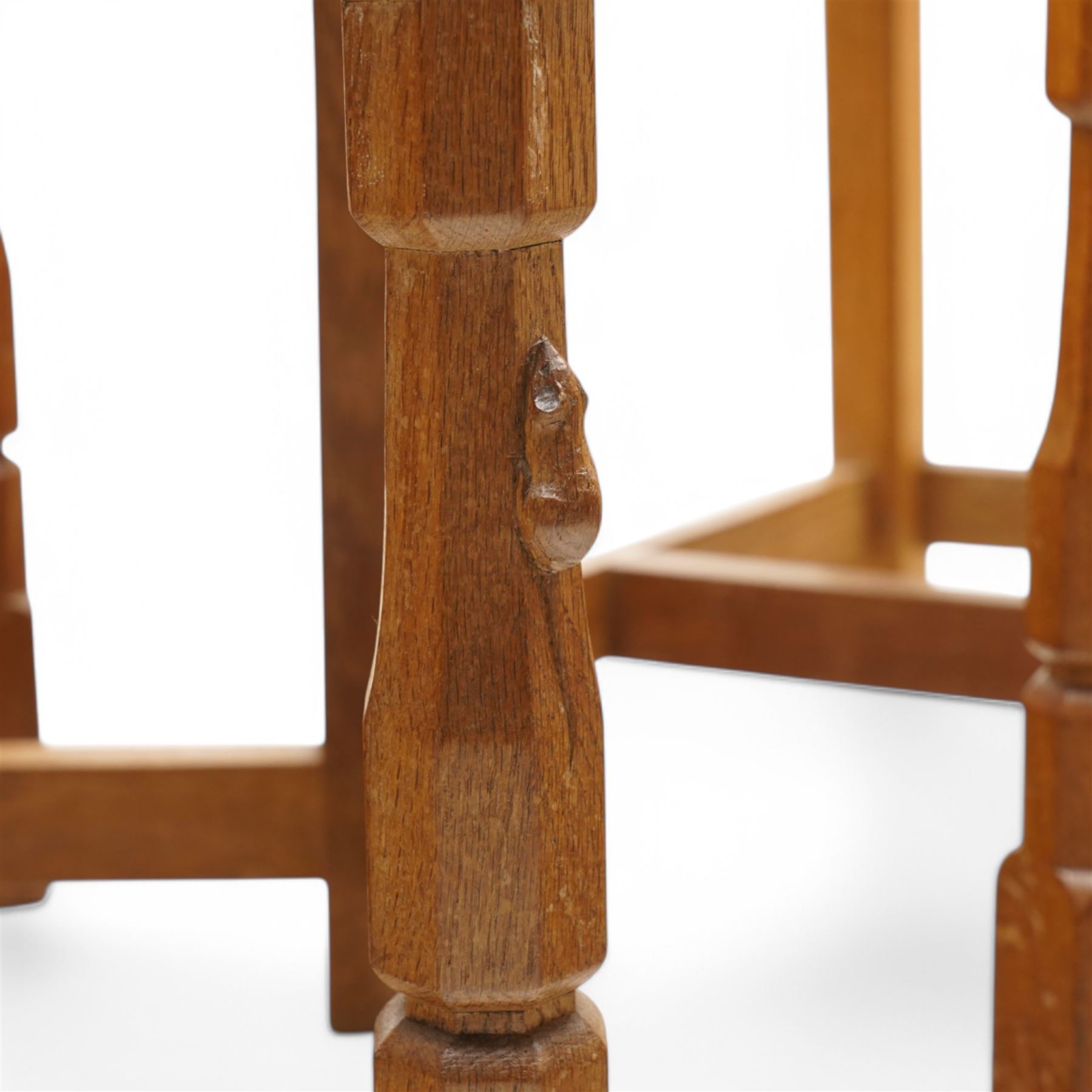 Mouseman - set of six (4+2) oak dining chairs, pierced and carved lattice back over leather upholstered seat, on octagonal front supports united by stretchers, carved with mouse signature, by the workshop of Robert Thompson, Kilburn