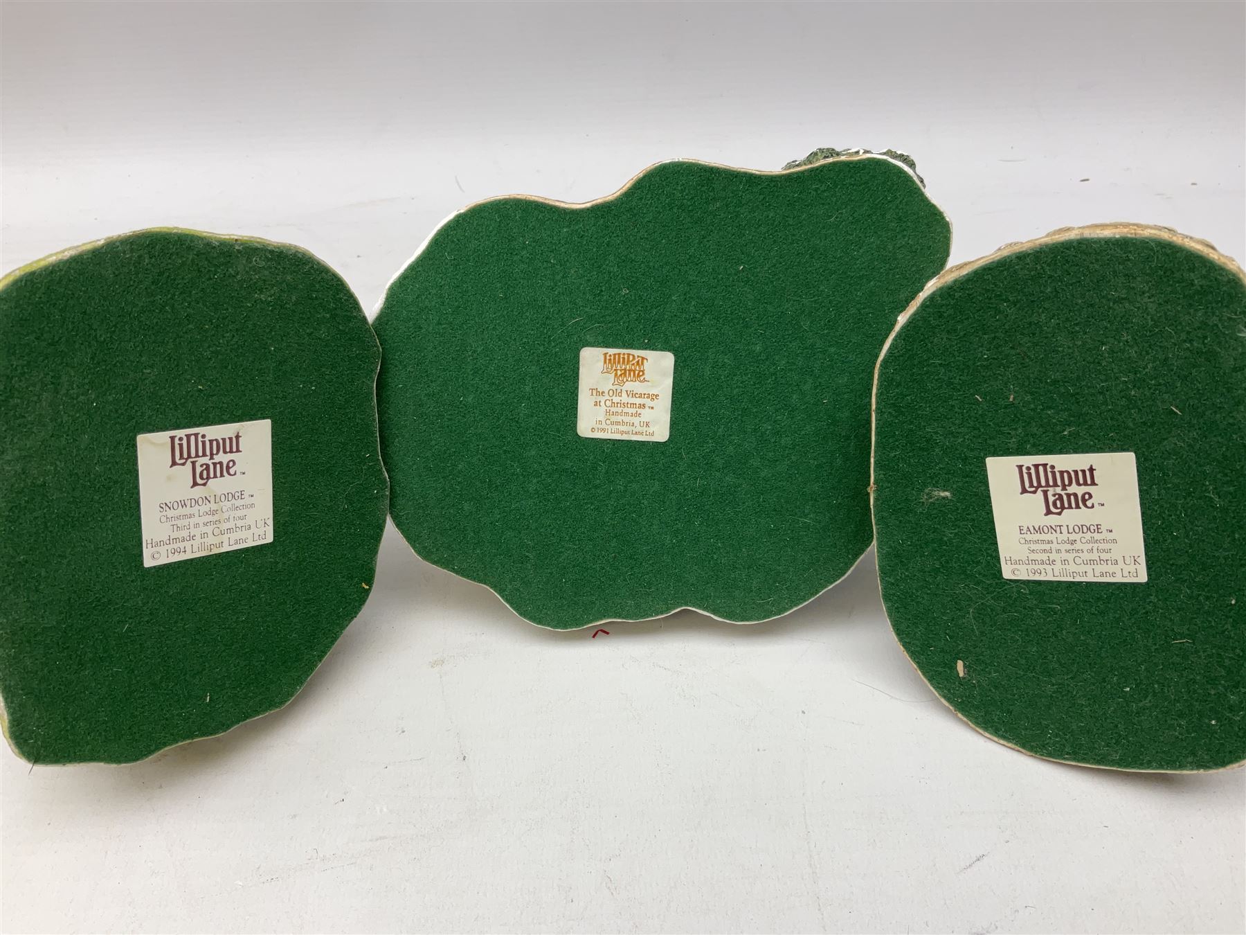 Sixteen Lilliput Lane models from Christmas collections, thirteen boxed and two loose, with various deeds, to include Snowdon Lodge, The Vicarage, Eamont Lodge etc