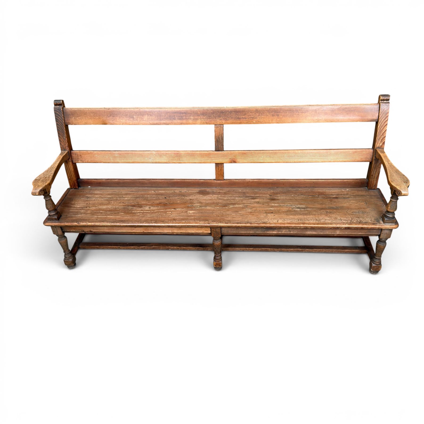 Early 20th century pine and oak bench seat, stained pine rail back frame with shaped oak arms