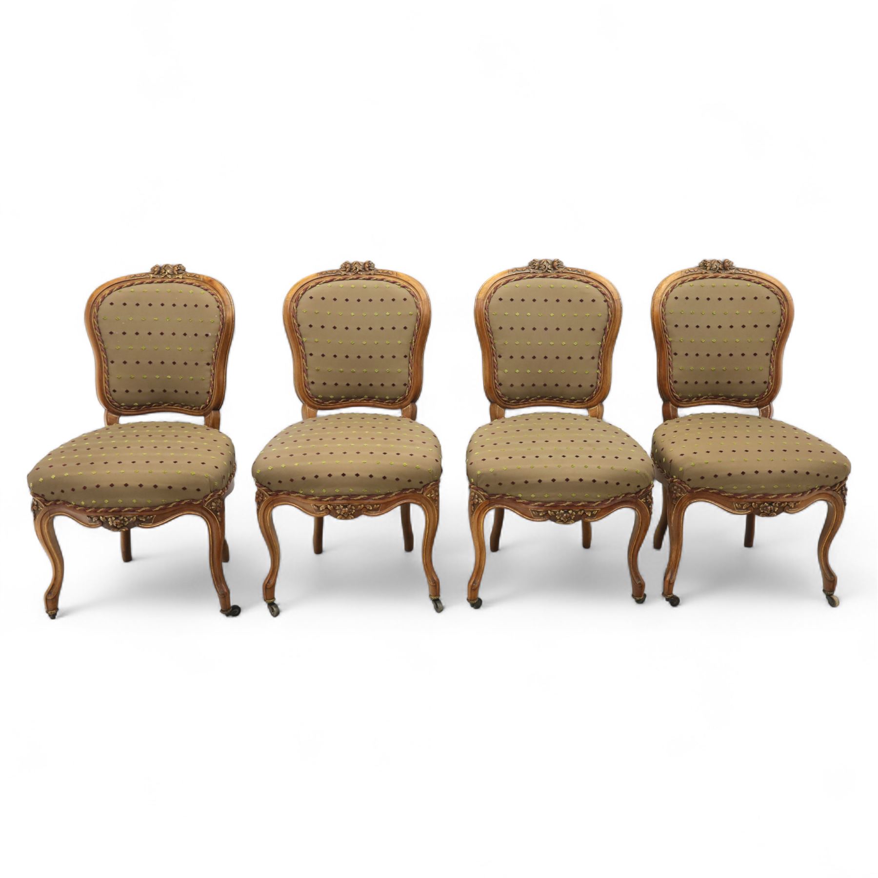 Set of four Victorian walnut framed salon chairs, upholstered in olive fabric with diamond embossed tufts