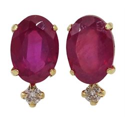 Pair of gold oval ruby and round brilliant cut stud earrings, stamped K18, total ruby weight approx 2.00 carat