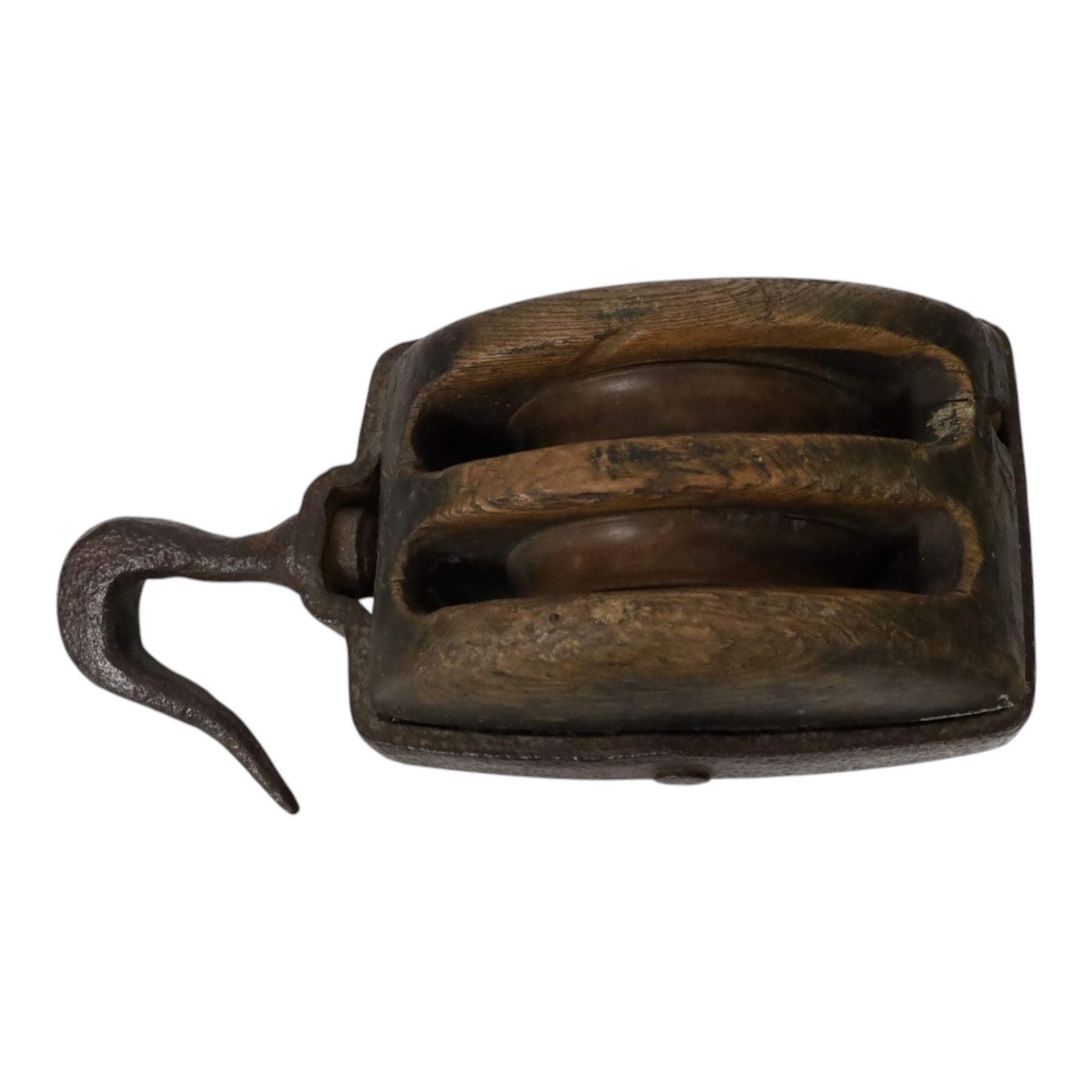 19th century double-sheave wooden pulley block in a metal casing, fitted with an iron hook, stamped GIS to one side, including hook L36cm