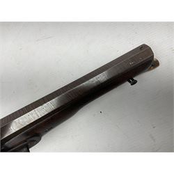 Early 19th century 16-bore flintlock single barrel travelling pistol, the 21.5cm stub twist octagonal barrel with two barrel pins and ramrod under, engraved lock plate with roller frizzen, engraved trigger guard with pineapple finial, walnut stoock with chequered grip L40cm overall
