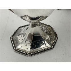 Victorian silver four piece tea service, comprising teapot, teapot stand, twin handled open sucrier and milk jug, each of octagonal form with foliate bud border and engraved decoration including crest to canted panels, and vacant panels, the teapot with ivory finial to the hinged cover and later wooden handle, hallmarked Edward Barnard & Sons Ltd, London1896, teapot including finial H15cm, milk jug including handle H16cm, teapot stand W11.5cm

This item has been registered for sale under Section 10 of the APHA Ivory Act