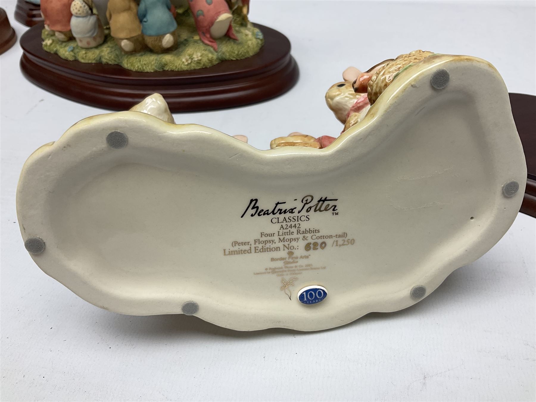 Four Border Fine Arts Beatrix Potter figures, comprising Tableau created to commemorate the Millenium together with a Border Fine Arts Limited Edition no 669814, The Tale of Peter Rabbit Tablet A1306, Four Little Rabbits A2442 and Sailing Home A2443