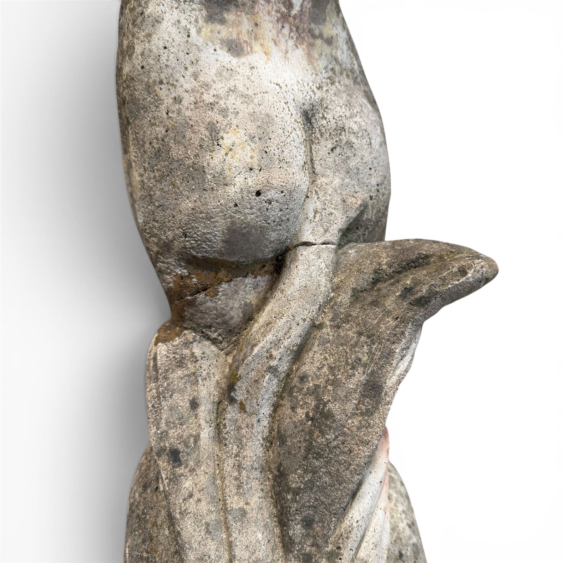 Two composition stone garden figures, comprising a seated boy figure and a standing classical draped female figure, each on square base, weathered painted finish.
