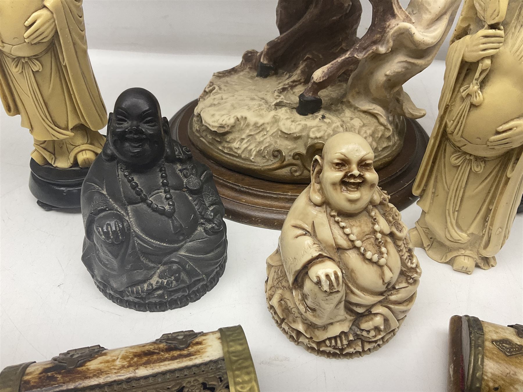 Composite figure of a couple upon a rearing horse, together with a collection of resin immortals and two bone chests 