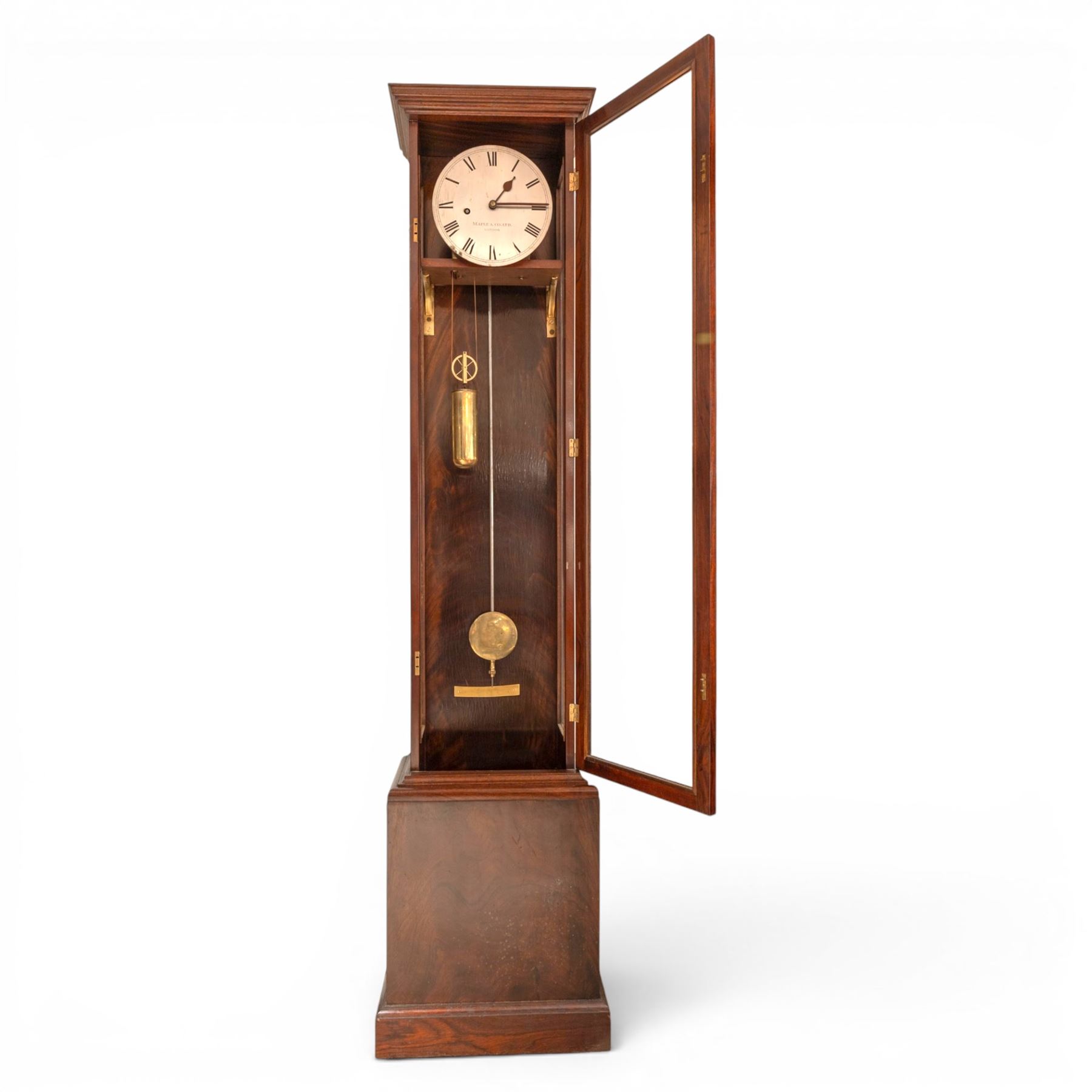 Edwardian mahogany regulator longcase clock, retailed by Maple & Co. Ltd., London, moulded cornice over glazed case enclosing a circular painted Roman numeral dial, single train weight-driven movement with brass cased weight and pendulum, on plinth base