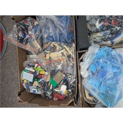 Large collection of loose Lego, including minifigures, together with three Lego ideas books, in five boxes