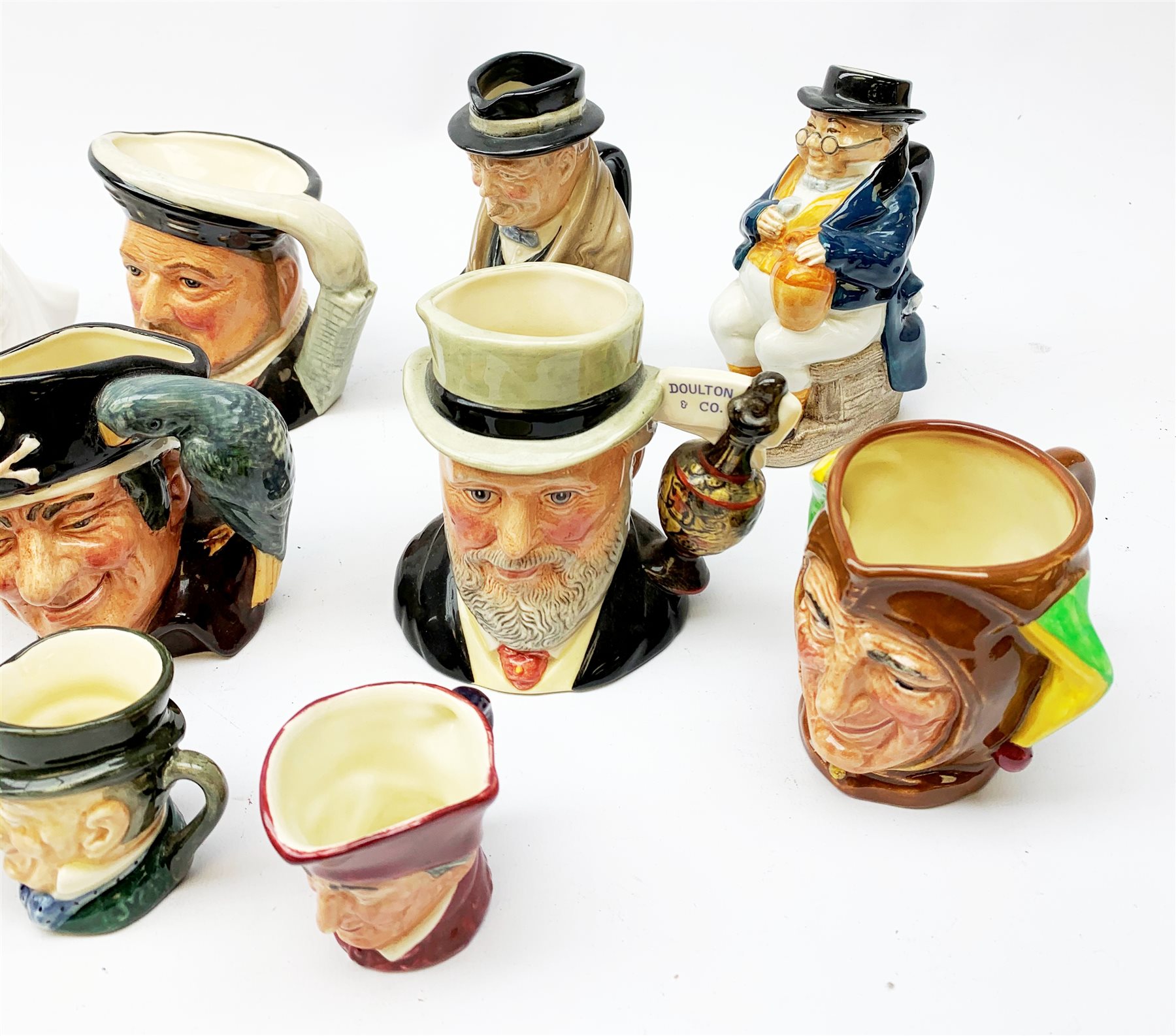  A limited edition Royal Doulton figurine, modelled as Sir Henry Doulton HN3891, no1154, with certificate, together with another Royal Doulton figurine Harmony HN4096, and a number of mostly Royal Doulton character jugs, including one modelled as Sir Henry Doulton D7057.   