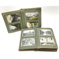 Two albums containing a quantity of Edwardian and later British and Continental topographical postcards. 