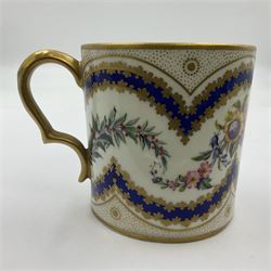 Sèvres soft paste porcelain coffee can and saucer with date code for 1767, painted with floral and laurel leaf garlands within blue scalloped and gilt borders, interlaced LL monogram enclosing the date letter O above painters mark for Catrice, coffee can H7.5cm, saucer D15cm