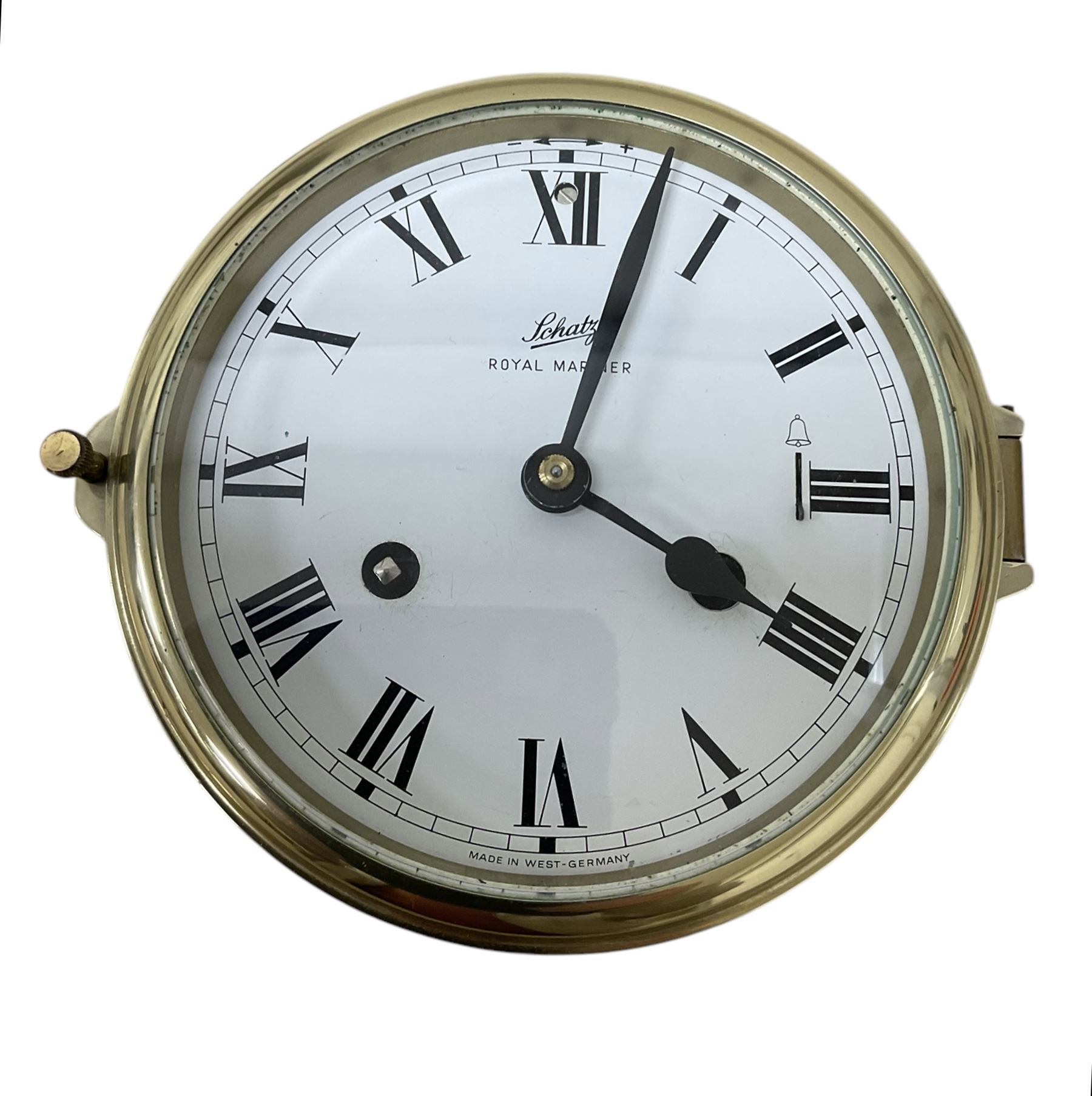 Schatz- 20th century Royal Mariner brass cased bulkhead mounted ships clock, twin train spring driven 8-day movement sounding the nautical watches on a bell, with a 5” dial, Roman numerals and spade hands. With key.  