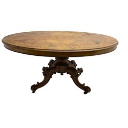 Victorian inlaid figured walnut loo table, oval moulded top inlaid with trailing foliage, turned and carved pedestal with four acanthus and scroll carved splayed supports