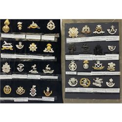 Collection of thirty-two reproduction military badges, including Royal Scots Fusiliers, Royal Lincolnshire Regiment, The Boarders Regiment etc. 