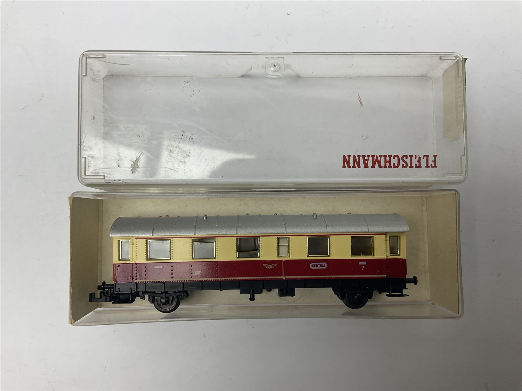 Fleischmann ‘N’ gauge ‘Piccolo’ - sixteen carriages, wagons and cars comprising nos. 8051, 8052, 8055, 8064, 8119K, 8127, 8128, 8129, 8202, 8211, 8224, 8240, 8281, 8301, 8500, 9372; along with Minitrix N503 Shock Van and 13576 6 ton Mineral Wagon; boxed and loose (18) 