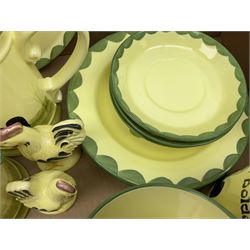 Zeller Fayencerie dinner and tea wares, decorated in cockerels against a yellow ground, with green scalloped border, comprising cake stand, two plates, bowl, three large teacups and saucers, coffee pot, milk jug, cream jug, lidded sugar bowl, pair of cruets modelled as cockerels, butter dish and cover, and utensils pot, and four similar egg cups, in one box 