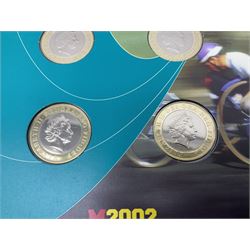 The Royal Mint Queen Elizabeth II 2002 Manchester Commonwealth Games four coin two pound coin  set in card display