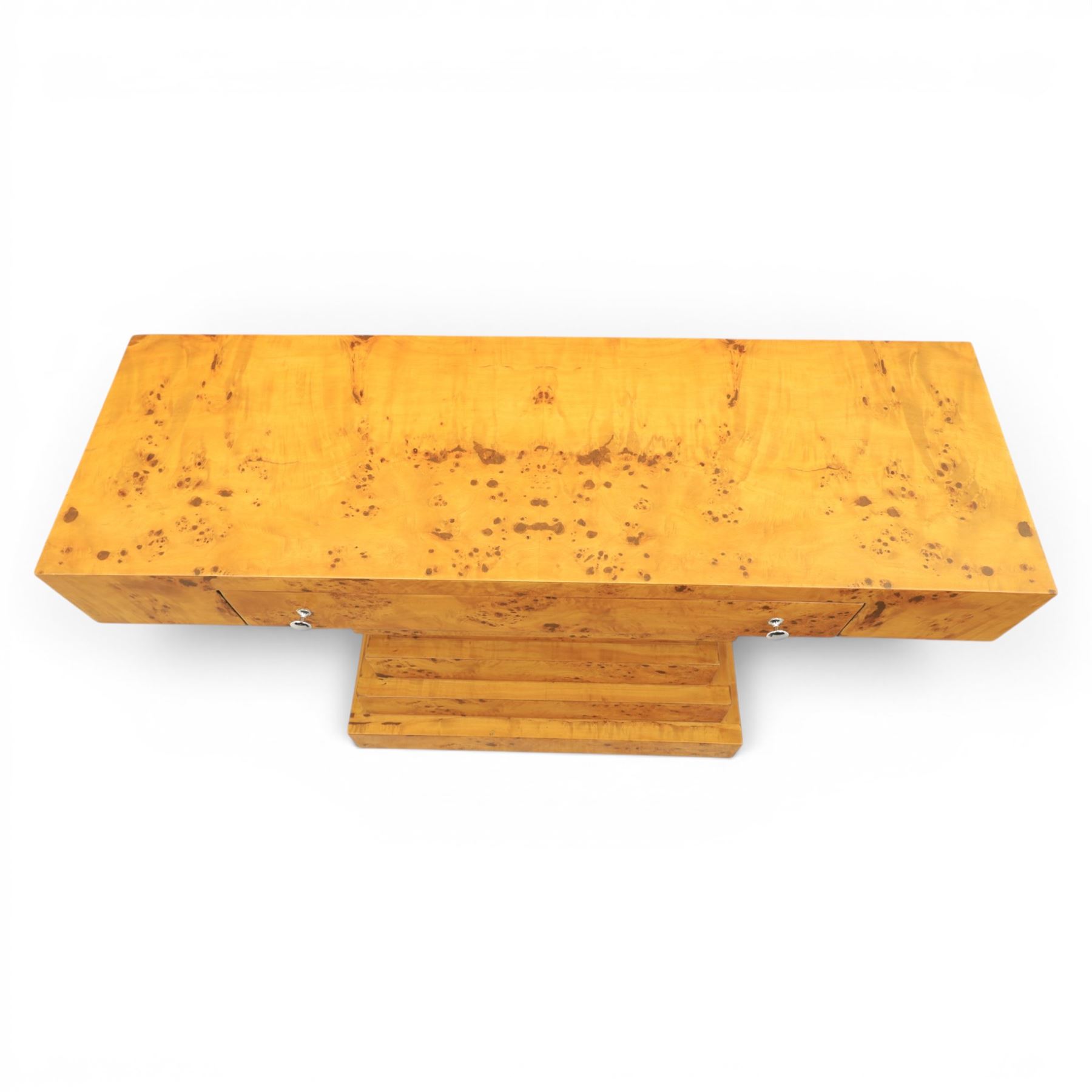 Art Deco style burr walnut console table, rectangular top fitted with a single frieze drawer with chrome pull handles, on stepped pedestal support and plinth base