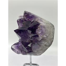 Amethyst crystal geode cluster, with large well-defined crystals, upon a metal stand, H21cm