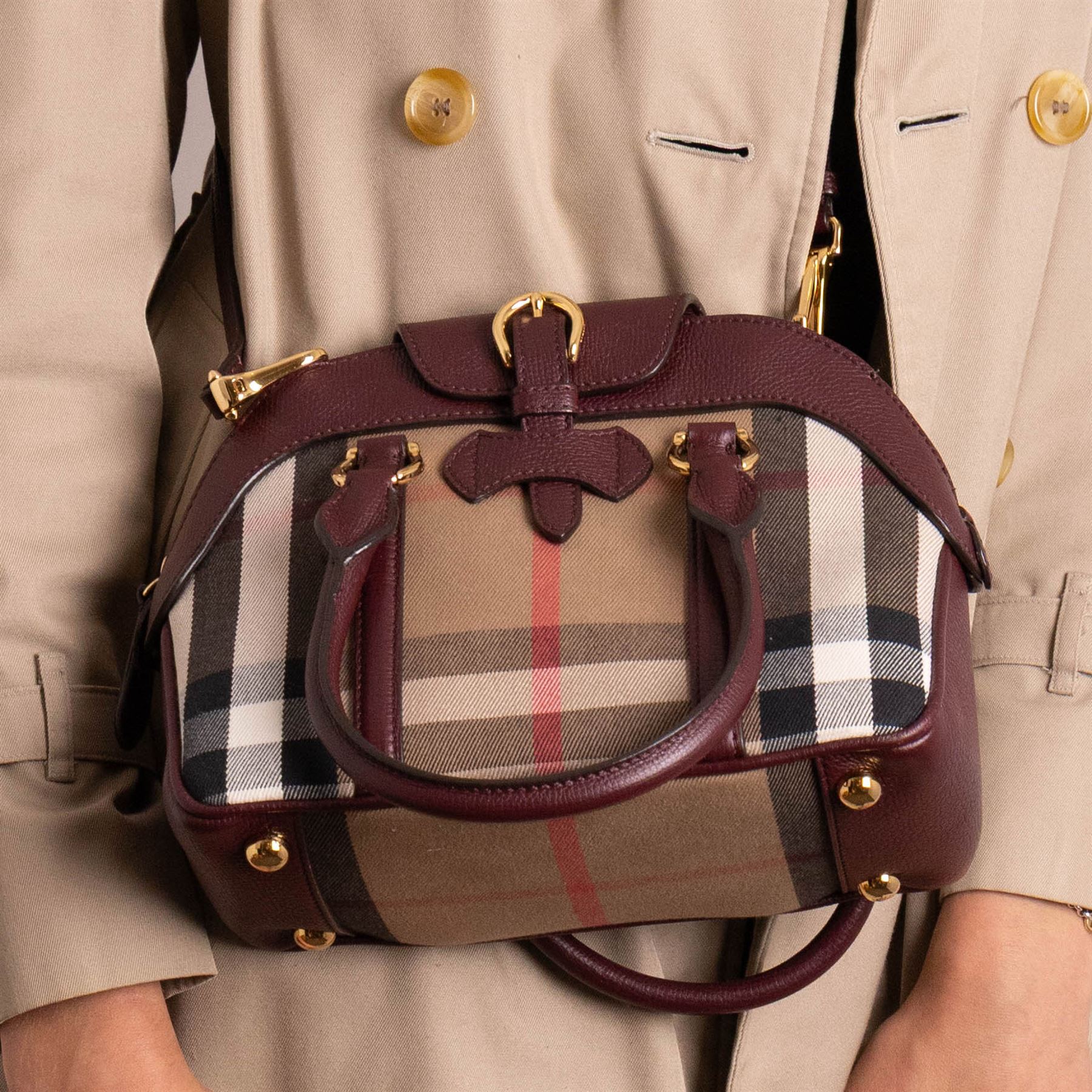 Burberry - ‘Milverton’ Small House Check Bag, introduced circa 2015 under Christopher Bailey, in signature Haymarket check canvas with oxblood grained leather trim and belted front detail, with rolled top handles and detachable shoulder or crossbody strap, with gold-tone hardware, unused with original dust bag