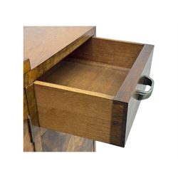 Art Deco burr walnut drinks cabinet, geometric central glazed astragal door enclosing two fixed shelves, flanked by symmetrical bookmatched veneered cupboards with drawers above 