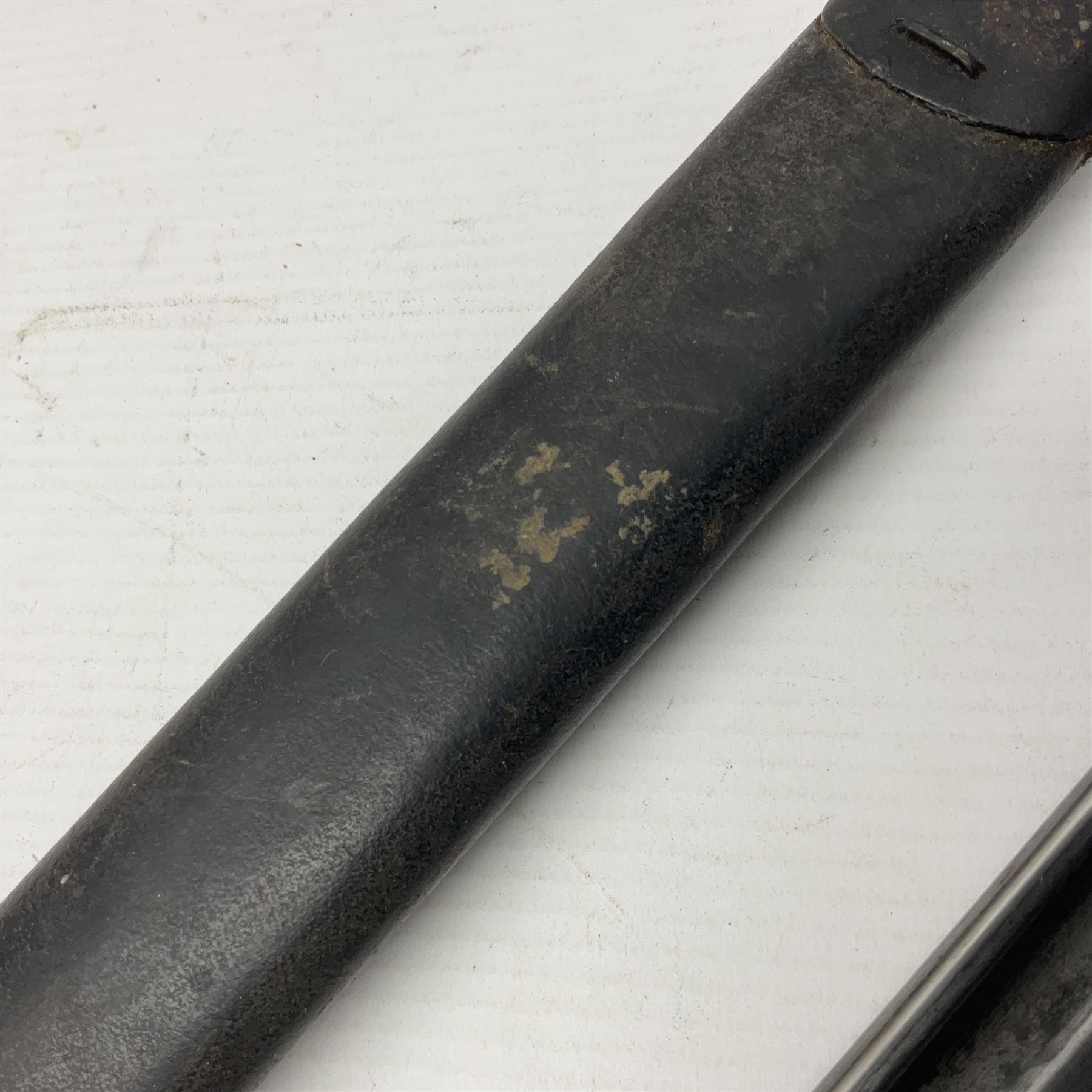 WWI British 1907 pattern bayonet, the 43cm fullered blade by Wilkinson with various marks to the ricasso; in leather covered scabbard numbered 294 to the throat and stamped M/58 L58.5cm overall