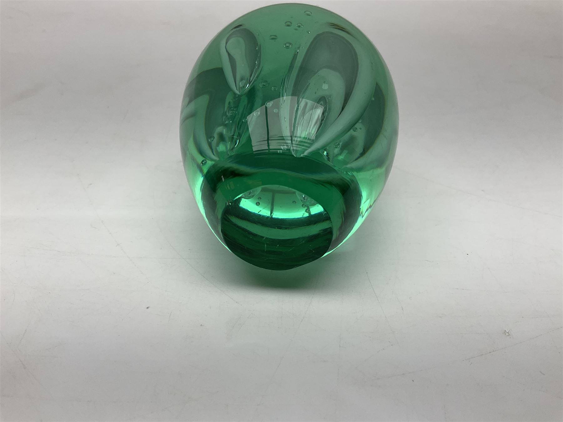 Three millefiori paperweights, together with a green glass dump paperweight with air bubble inclusions, Caithness Daisy and Cauldron paperweights and two small Caithness glass vases, tallest H9cm