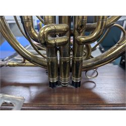 Boosey & Co Ltd French horn, converted into a table lamp, upon a wooden plinth, H45cm