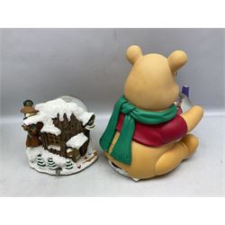 Six Disney Winnie the Pooh Christmas snow globes, comprising large Mr Christmas Holiday Snowfall, An Enchanted Christmas, It's A Small World Christmas 1994,  Tree Trimming, 1995 Christmas At Our House and Christmas Band Concert, together with Mr Christmas Holiday Go Round, all with boxes (7)