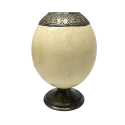 Early 20th Century silver mounted ostrich egg by Henry Cook, stamped Birmingham 1908, the vase with stamped silver circular spreading foot beneath and upper silver (tested approx 90%, unmarked) mounted collar with pierced foliate design, H17.5cm
