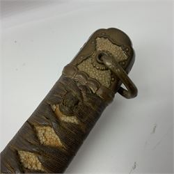 WW2 Japanese Army officer's shin gunto/katana sword with 68.5cm steel single edged blade, foliate cast brass tsuba, bound fish-skin grip with brass mounts, inscribed marks to both sides of tang; in lacquered wooden scabbard with brass mounts and locking button L97cm overall