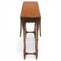 Edwardian mahogany Sutherland table, shaped rectangular drop-leaf top with canted corners and moulded edge, raised on ring-turned gate-leg base united by stretchers