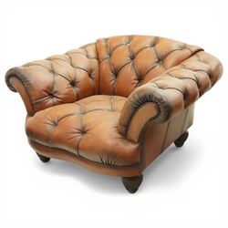 Tetrad England - large armchair upholstered in buttoned leather, with stool